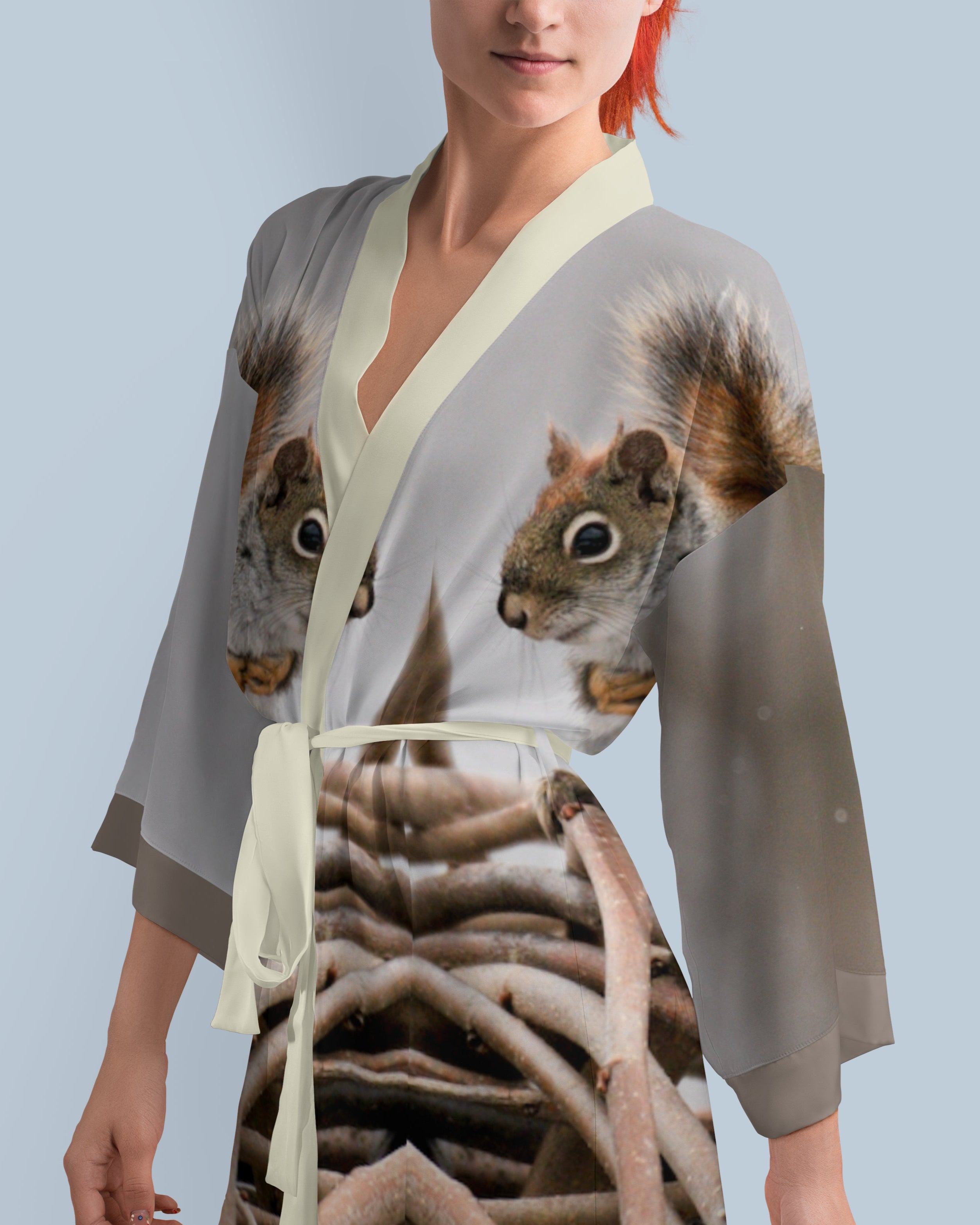 Woman wearing a kimono-style robe with a photo print squirrel design 